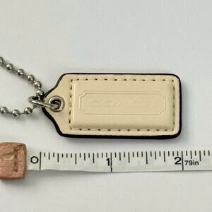 Coach ivory patent leather key fob bag charm hangtag silver-tone hardware 2”